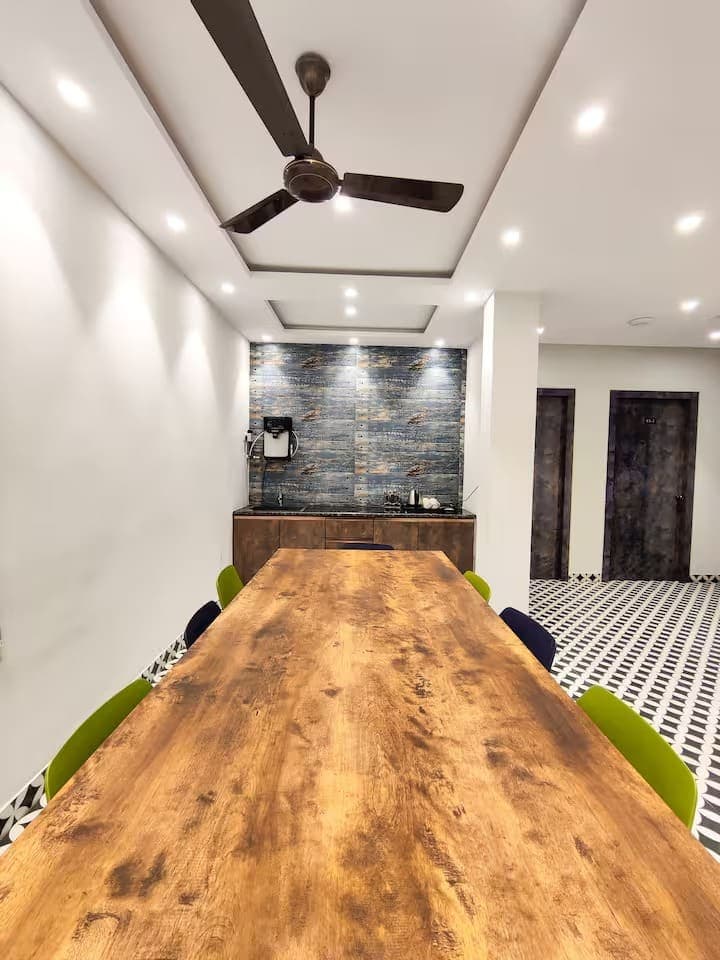 Communal dining table and service counter at an INSATA property