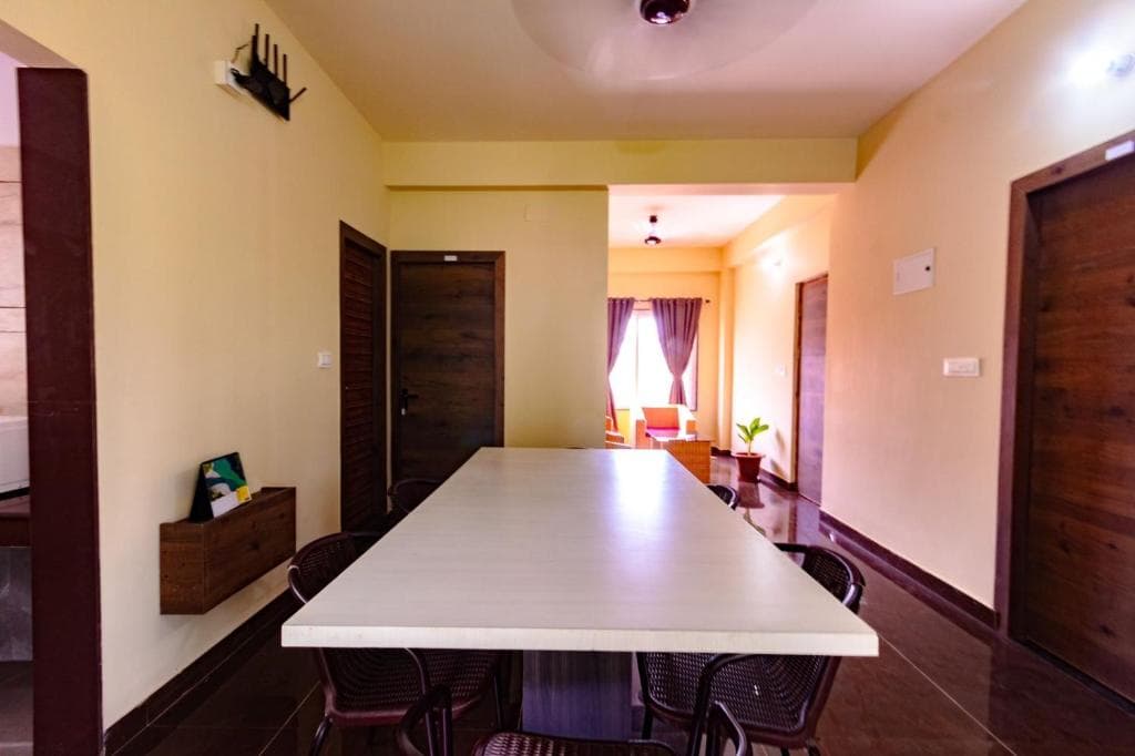 Long shared table in the common area of an INSATA property